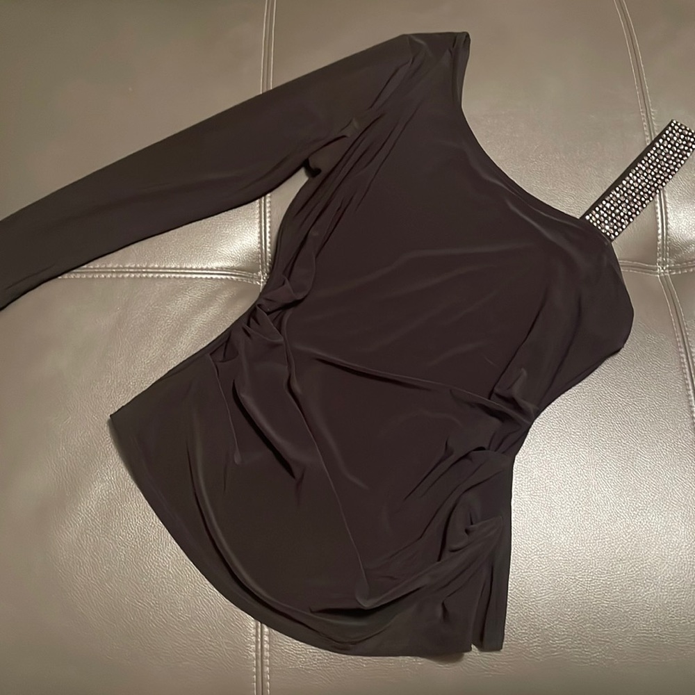 Sexy top with bling shoulder accent. Good to dress up for the holidays.